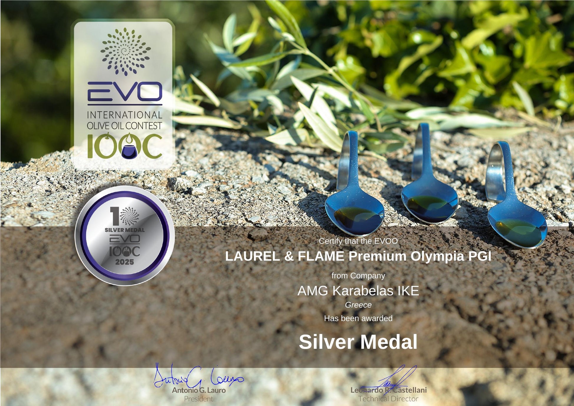 Silver medal for EVO olive oil contest with olive leaves and olive oil dropper on a stone surface